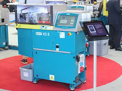 Two Injection Moulding Machines at Plast Milan: A small giant and a big dwarf