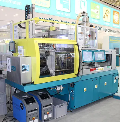 Two Injection Moulding Machines at Plast Milan: A small giant and a big dwarf